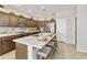 Well-appointed kitchen featuring granite counters, stainless steel appliances, ample cabinetry, and island with seating at 24816 S Golfview Dr # 46, Sun Lakes, AZ 85248