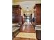 Elegant lobby featuring dark wood accents, comfortable seating, and a well-lit hallway for a welcoming atmosphere at 24816 S Golfview Dr # 46, Sun Lakes, AZ 85248