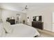 Comfortable main bedroom featuring carpeted floors, ceiling fan, and convenient access to the en-suite bath at 24816 S Golfview Dr # 46, Sun Lakes, AZ 85248