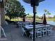 Spacious outdoor patio overlooking the water, complete with tables, chairs, and heaters at 24816 S Golfview Dr # 46, Sun Lakes, AZ 85248