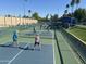 Outdoor pickleball courts showcase an active lifestyle with lush landscaping and blue courts at 24816 S Golfview Dr # 46, Sun Lakes, AZ 85248