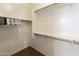 Bright walk-in closet featuring multiple rods and shelves for organized storage of clothes and accessories at 24816 S Golfview Dr # 46, Sun Lakes, AZ 85248