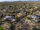 New home construction in a golf community offers sprawling views of the surrounding desert landscape at 29121 N 105Th St, Scottsdale, AZ 85262
