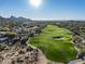 Scenic golf course with pristine green fairways and stunning mountain views, and neighboring community at 29121 N 105Th St, Scottsdale, AZ 85262