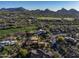 Luxury home under construction in a golf community surrounded by beautiful landscaping and mountain views at 29121 N 105Th St, Scottsdale, AZ 85262