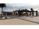 Desert modern home with a large driveway, desert landscaping, and a spacious covered outdoor living area at 29121 N 105Th St, Scottsdale, AZ 85262