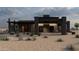 Stylish home featuring modern design elements and desert landscaping with natural greenery at 29121 N 105Th St, Scottsdale, AZ 85262