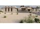 New home features modern design with desert landscaping, spacious driveway and contemporary lighting at 29121 N 105Th St, Scottsdale, AZ 85262