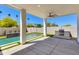 Spacious patio overlooking the pool and well-maintained backyard with built in grill at 2927 E Osborn Rd, Phoenix, AZ 85016