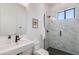 Modern bathroom featuring a glass shower, stylish sink and toilet at 2927 E Osborn Rd, Phoenix, AZ 85016