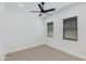 Bedroom with neutral carpet, fan, and windows with blinds at 2927 E Osborn Rd, Phoenix, AZ 85016