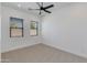 Bedroom with neutral carpet, fan, and windows with blinds at 2927 E Osborn Rd, Phoenix, AZ 85016