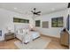Stylish bedroom features a ceiling fan, accent wall, and great natural light at 2927 E Osborn Rd, Phoenix, AZ 85016