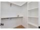 Walk-in closet with built-in shelving and ample storage space at 2927 E Osborn Rd, Phoenix, AZ 85016