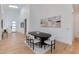 Elegant dining room featuring a modern table and chairs, with wood flooring and skylights at 2927 E Osborn Rd, Phoenix, AZ 85016