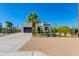 Modern white home with desert landscaping, black trim, palm tree and concrete driveway at 2927 E Osborn Rd, Phoenix, AZ 85016