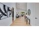 Bright foyer with wood floors and modern decor leading into open living spaces at 2927 E Osborn Rd, Phoenix, AZ 85016