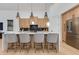 Modern kitchen with light wood cabinetry, stainless steel appliances, and quartz countertops at 2927 E Osborn Rd, Phoenix, AZ 85016