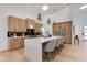 Bright kitchen with a large island, pendant lighting, wood cabinets, and modern appliances at 2927 E Osborn Rd, Phoenix, AZ 85016