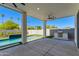Spacious covered patio features a built-in grill, ceiling fans, and pool view at 2927 E Osborn Rd, Phoenix, AZ 85016