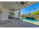 Covered patio overlooking a pool with fountain feature and turf landscaping at 2927 E Osborn Rd, Phoenix, AZ 85016