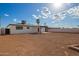 Wide view of the backyard, complete with covered patio and white block wall at 3044 W Dahlia Dr, Phoenix, AZ 85029
