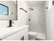 Bathroom featuring a modern walk in shower, stone countertop and black hardware at 3044 W Dahlia Dr, Phoenix, AZ 85029