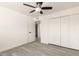 A light-filled bedroom features wood-look flooring and closet space at 3044 W Dahlia Dr, Phoenix, AZ 85029