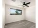 Bedroom features a large window and light grey toned wood flooring at 3044 W Dahlia Dr, Phoenix, AZ 85029