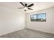 Bedroom with wood-look flooring, a ceiling fan, and a window view of the outdoors at 3044 W Dahlia Dr, Phoenix, AZ 85029