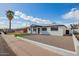Inviting single-story home with a landscaped front yard and a quaint, covered entrance at 3044 W Dahlia Dr, Phoenix, AZ 85029