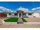 Charming single-story home with well-maintained lawn and inviting front porch at 3044 W Dahlia Dr, Phoenix, AZ 85029