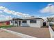 Inviting single-story home with a landscaped front yard and a quaint, covered entrance at 3044 W Dahlia Dr, Phoenix, AZ 85029
