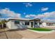 Charming single-story home featuring a front yard with decorative stone and artificial turf at 3044 W Dahlia Dr, Phoenix, AZ 85029