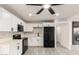 Bright kitchen features stainless appliances, white cabinetry and grey toned wood flooring at 3044 W Dahlia Dr, Phoenix, AZ 85029