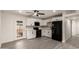 Bright kitchen features stainless appliances, white cabinetry and grey toned wood flooring at 3044 W Dahlia Dr, Phoenix, AZ 85029
