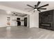 Open-concept living space with modern fireplace and updated kitchen, perfect for entertaining at 3044 W Dahlia Dr, Phoenix, AZ 85029