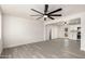 Bright and airy living room featuring sleek hardwood floors and contemporary ceiling fans at 3044 W Dahlia Dr, Phoenix, AZ 85029