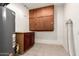 Utility room with tile flooring, water heater, and built-in storage cabinets at 3044 W Dahlia Dr, Phoenix, AZ 85029