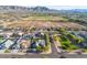 Scenic aerial view of a residential neighborhood, with mountain views and green space at 3125 W Desert Ln, Laveen, AZ 85339