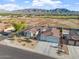 Sprawling residence featuring meticulous landscaping, convenient three-car garage, and mountain views at 3125 W Desert Ln, Laveen, AZ 85339