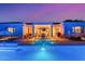 Stunning backyard pool featuring a covered patio perfect for outdoor dining and relaxation at twilight at 3125 W Desert Ln, Laveen, AZ 85339