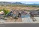 Expansive home with landscaped yard, circular entryway, 3-car garage, and mountain views at 3125 W Desert Ln, Laveen, AZ 85339