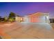 Charming single-Gathering home with a three-car garage and professionally landscaped front yard at 3125 W Desert Ln, Laveen, AZ 85339