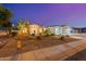 Charming single-Gathering home with a three-car garage and professionally landscaped front yard at 3125 W Desert Ln, Laveen, AZ 85339