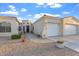 Inviting home featuring three-car garage, circular entryway, and low maintenance landscaping at 3125 W Desert Ln, Laveen, AZ 85339