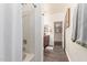 Bathroom showcasing a shower with glass door and adjacent toilet with door leading to vanity at 318 E Taylor Trl, San Tan Valley, AZ 85143