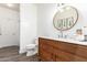 Charming bathroom featuring a wooden vanity with a vessel sink and stylish fixtures at 318 E Taylor Trl, San Tan Valley, AZ 85143