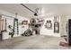 Spacious two car garage with mounted storage racks and a water heater at 318 E Taylor Trl, San Tan Valley, AZ 85143