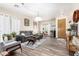 Comfortable living room with a gray sofa, wood flooring, and bright, neutral decor at 318 E Taylor Trl, San Tan Valley, AZ 85143
